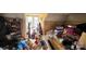 A cluttered bedroom with items scattered around and a window letting in natural light at 3181 N Olivers Cross Rd, Newton, NC 28658