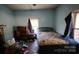 Bedroom with a bed and window, offering a private space with natural light at 3181 N Olivers Cross Rd, Newton, NC 28658