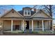 Exterior view of a two-story house with a front porch, showcasing its architectural style and outdoor space at 3181 N Olivers Cross Rd, Newton, NC 28658