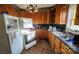 Kitchen with older appliances and cabinetry, presenting an opportunity for renovation and customization at 3181 N Olivers Cross Rd, Newton, NC 28658