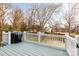 A deck with a grill overlooking the backyard and the neighborhood behind the fenced yard at 331 Solomon St, Charlotte, NC 28216