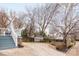 View of backyard, detached garage and driveway, accessible via a walkway from the deck with stairs at 331 Solomon St, Charlotte, NC 28216