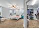 Comfortable carpeted bedroom features a closet, ceiling fan, and multiple windows at 331 Solomon St, Charlotte, NC 28216