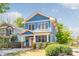 Stylish two-story home featuring a bright orange door and well-manicured landscaping at 331 Solomon St, Charlotte, NC 28216