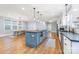 Open kitchen with a center island, stainless steel appliances, and a dining area at 331 Solomon St, Charlotte, NC 28216