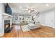 Spacious living room with hardwood floors, a fireplace, and abundant natural light at 331 Solomon St, Charlotte, NC 28216