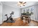 Well-lit home office space with hardwood floors, multiple windows and a ceiling fan at 331 Solomon St, Charlotte, NC 28216