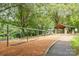 Community playground area with swings, tables, and covered picnic area for families at 331 Solomon St, Charlotte, NC 28216