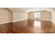 Large bedroom with vaulted ceilings, hardwood floors, and plenty of natural light at 409 Running Horse Ln, Waxhaw, NC 28173