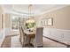 Formal dining room with elegant lighting and large window at 409 Running Horse Ln, Waxhaw, NC 28173