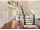 Spacious foyer with hardwood floors and staircase at 409 Running Horse Ln, Waxhaw, NC 28173