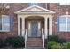 Inviting front porch with brick steps and decorative pillars at 409 Running Horse Ln, Waxhaw, NC 28173