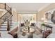 Cozy living room with comfortable seating, hardwood floors, and elegant trim work at 409 Running Horse Ln, Waxhaw, NC 28173