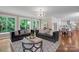 Open floor plan living room showing the view of kitchen and the backyard at 409 Running Horse Ln, Waxhaw, NC 28173