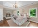Bright main bedroom with hardwood floors, and a sitting room at 409 Running Horse Ln, Waxhaw, NC 28173