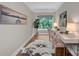 Home office featuring two desks, modern chairs, natural light, and stylish decor at 409 Running Horse Ln, Waxhaw, NC 28173