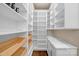 Walk-in pantry with shelving, drawers, and marble countertop with cabinets at 409 Running Horse Ln, Waxhaw, NC 28173