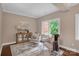 Cozy sitting room with natural light, hardwood floors, and comfortable seating at 409 Running Horse Ln, Waxhaw, NC 28173