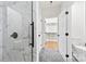 Walk-in shower with glass enclosure and large marble tiles at 412 W Westview St, Gastonia, NC 28052
