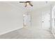 Bedroom featuring neutral carpeting, a ceiling fan, and easy access to other rooms via the hallway at 412 W Westview St, Gastonia, NC 28052