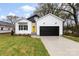 Charming new construction home featuring a black garage door and a bright yellow front door at 412 W Westview St, Gastonia, NC 28052