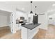 Modern kitchen with white cabinets, gray countertops, and stainless steel appliances at 412 W Westview St, Gastonia, NC 28052