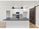 Modern kitchen featuring a kitchen island with a black sink and faucet at 412 W Westview St, Gastonia, NC 28052