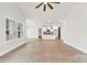 Spacious living room with a ceiling fan, hardwood floors, and large windows for lots of natural light at 412 W Westview St, Gastonia, NC 28052