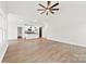 Open-concept living room featuring hardwood floors, a kitchen island, and a sliding barn door at 412 W Westview St, Gastonia, NC 28052