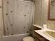 Bathroom featuring a shower/tub combo and a single sink vanity at 459 Towell St, Mooresville, NC 28115