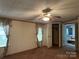 Bedroom featuring a ceiling fan, closet, and ensuite bathroom access at 459 Towell St, Mooresville, NC 28115
