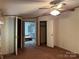Bedroom featuring a ceiling fan, closet, and ensuite bathroom access at 459 Towell St, Mooresville, NC 28115