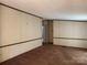Spacious living room featuring a large window and neutral walls at 459 Towell St, Mooresville, NC 28115