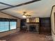 Cozy living room featuring a stone fireplace and built-in shelving at 459 Towell St, Mooresville, NC 28115