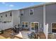 Aerial view of a backyard deck with patio furniture and grill area, set against a gray house exterior at 502 Tayberry Ln, Fort Mill, SC 29715