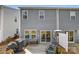 A fenced backyard with a wooden deck, patio furniture, and sliding glass door leading to the house at 502 Tayberry Ln, Fort Mill, SC 29715