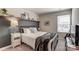 Cozy bedroom with decorative shelf, black metal bed frame, and a window with blinds at 502 Tayberry Ln, Fort Mill, SC 29715