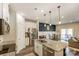 Bright kitchen featuring a granite island, stainless steel appliances, and view of dining area at 502 Tayberry Ln, Fort Mill, SC 29715