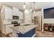 Modern kitchen with stainless steel appliances, granite countertops, and a central island with sink at 502 Tayberry Ln, Fort Mill, SC 29715