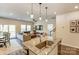 Open kitchen with an island, stainless steel appliances, and seamless transition to the living area at 502 Tayberry Ln, Fort Mill, SC 29715