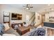 View of living room with modern furnishings, stairs and kitchen access for easy entertaining at 502 Tayberry Ln, Fort Mill, SC 29715