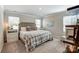 Relaxing main bedroom with natural lighting, a bed with a patterned blanket, and matching bedside tables at 502 Tayberry Ln, Fort Mill, SC 29715