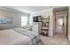 Spacious main bedroom features a TV, dresser, decor, and a doorway to the connected main bathroom at 502 Tayberry Ln, Fort Mill, SC 29715