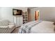 Comfortable main bedroom with a tall dresser, wall mounted television, and an accent chair at 502 Tayberry Ln, Fort Mill, SC 29715