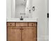 Bathroom vanity features a neutral wood cabinet at 520 Shoal Rd, Lincolnton, NC 28092