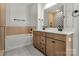 Bathroom featuring double vanity, a soaking tub, and tile flooring at 520 Shoal Rd, Lincolnton, NC 28092