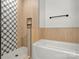 Modern bathroom featuring a stylish shower with unique tile and a soaking tub at 520 Shoal Rd, Lincolnton, NC 28092