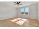 Bright bedroom features a ceiling fan and sunny window at 520 Shoal Rd, Lincolnton, NC 28092