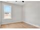 Bright bedroom features a sunny window and light hardwood floors at 520 Shoal Rd, Lincolnton, NC 28092