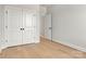 Bedroom with light hardwood floors, closet, and white doors at 520 Shoal Rd, Lincolnton, NC 28092